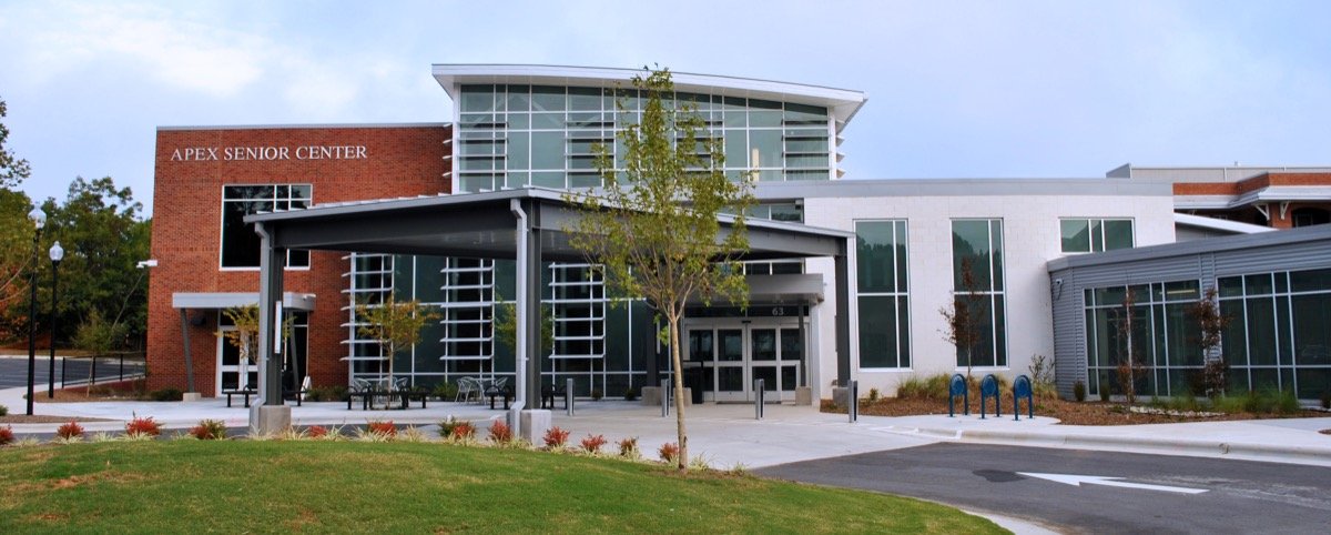 Modern brick and glass entrance to the Apex Senior Center