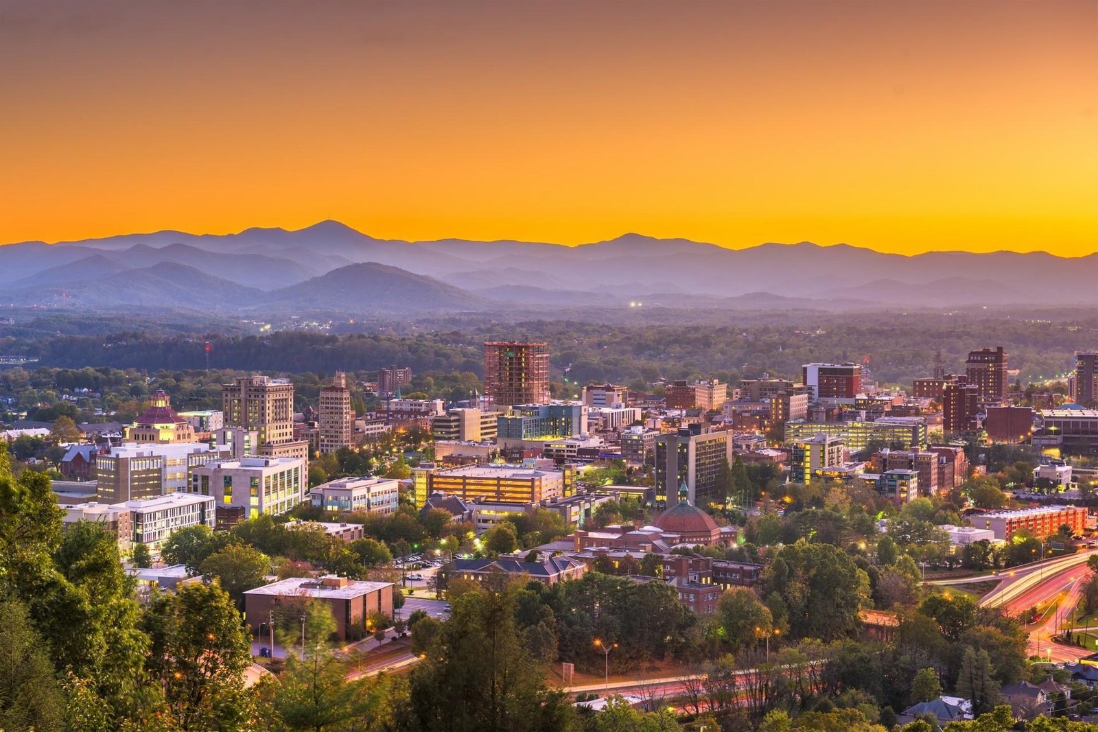 Downtown Asheville skyline with the Blue Ridge Mountains behind it