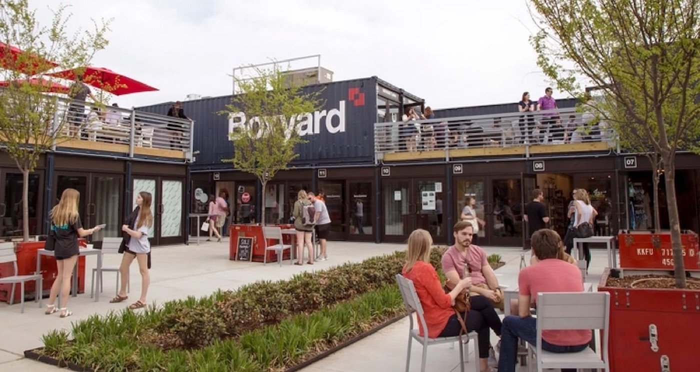 Colorful shipping-container restaurants surrounding the Boxyard RTP courtyard