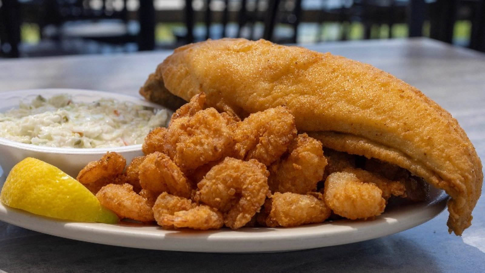 Plate of lightly breaded fried seafood in the Calabash style