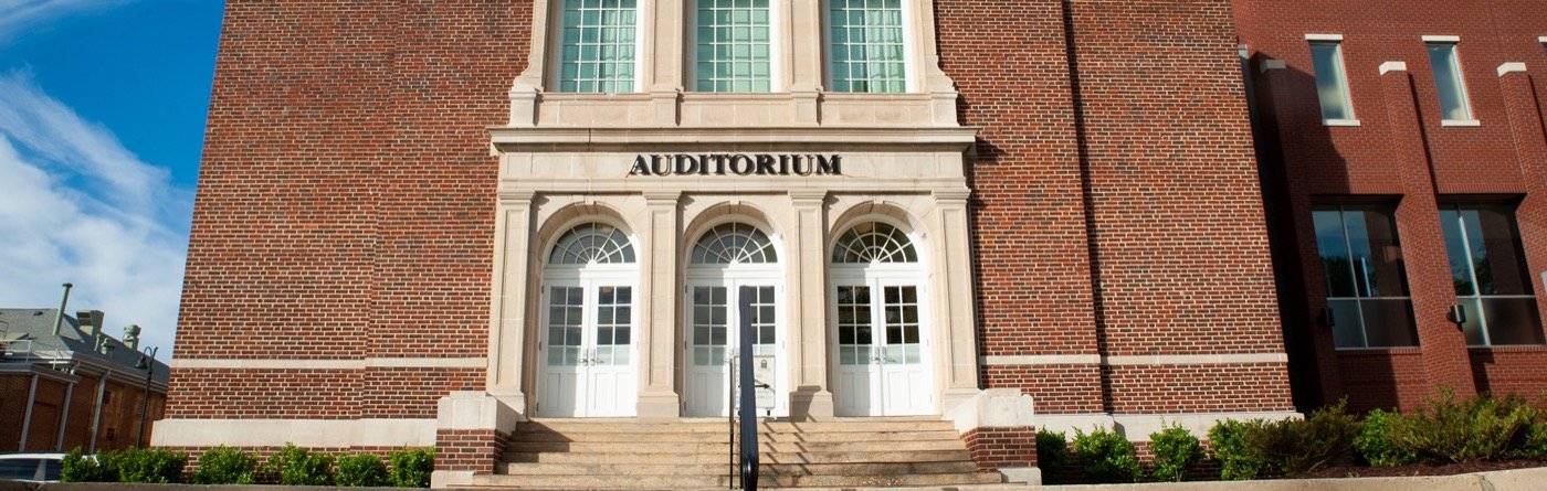 Historic brick auditorium entrance at The Clayton Center