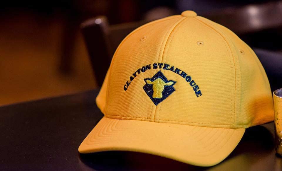 A Clayton Steakhouse cap displayed in the restaurant
