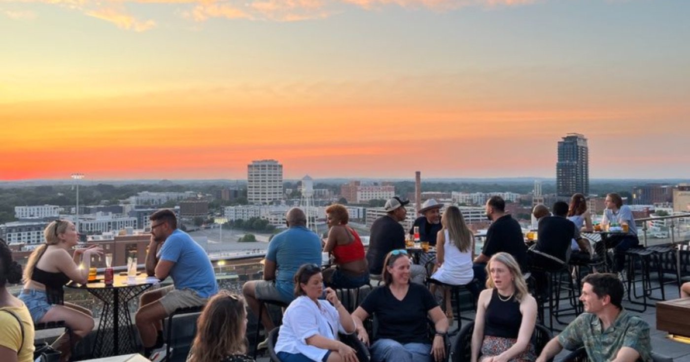 Downtown Durham skyline and historic district buildings at sunset