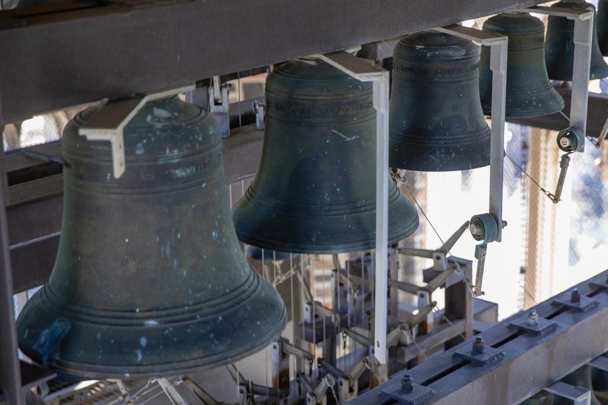 Large bronze carillon bells inside the tower of Duke Chapel