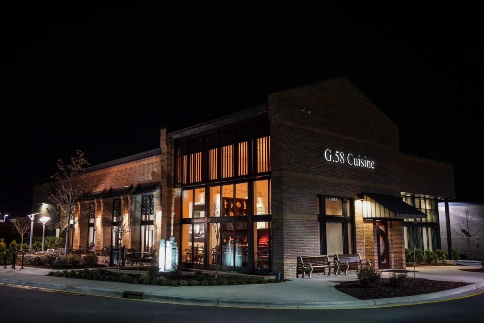 The illuminated exterior of G.58 Cuisine in Morrisville