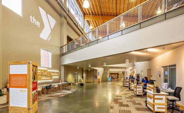 Bright lobby and upper-level indoor track at the Northwest Cary YMCA