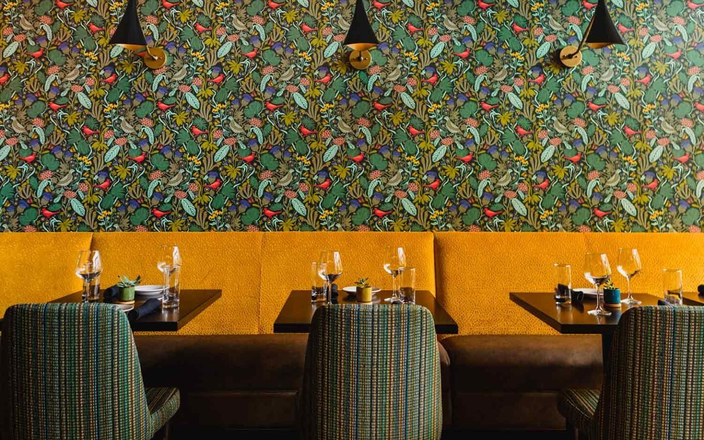 The colorful dining room at Peck and Plume in Cary