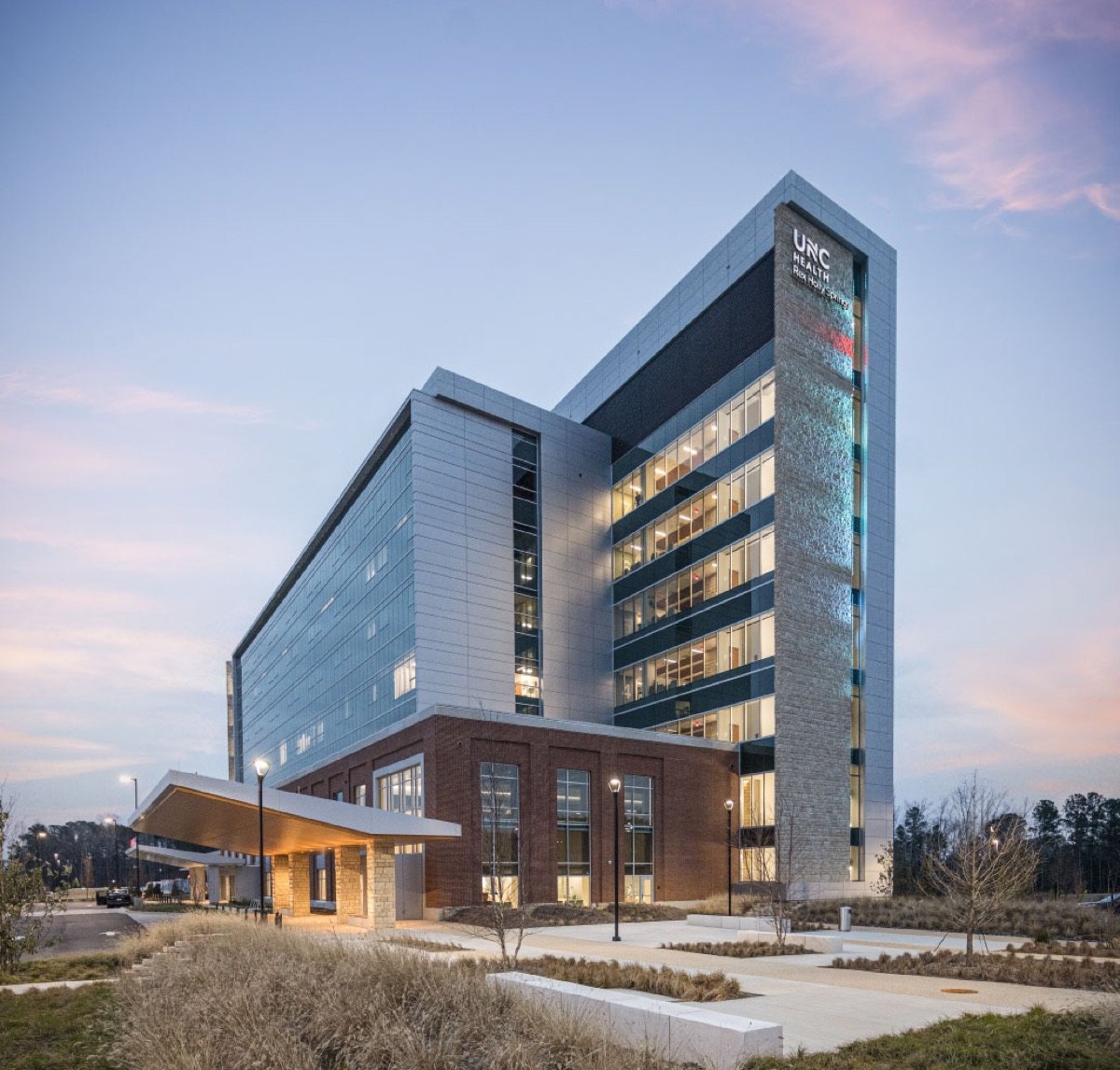 UNC Health Rex Holly Springs Hospital illuminated at dusk