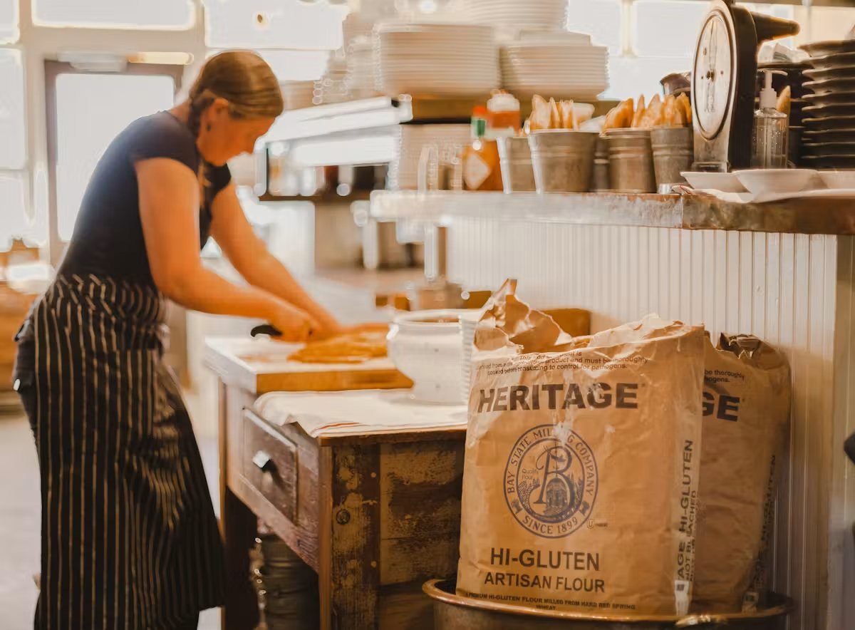 A baker working in the kitchen at Vin Rouge in Durham