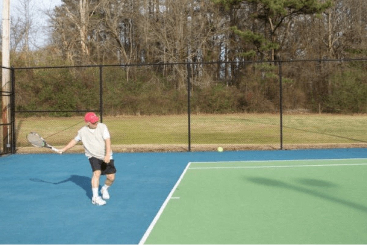 A pickleball player returning a shot at Wendell Town Park