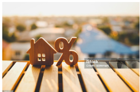 House and percentage symbols representing mortgage interest rates