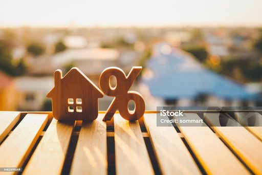 House and percentage symbol representing mortgage interest rates