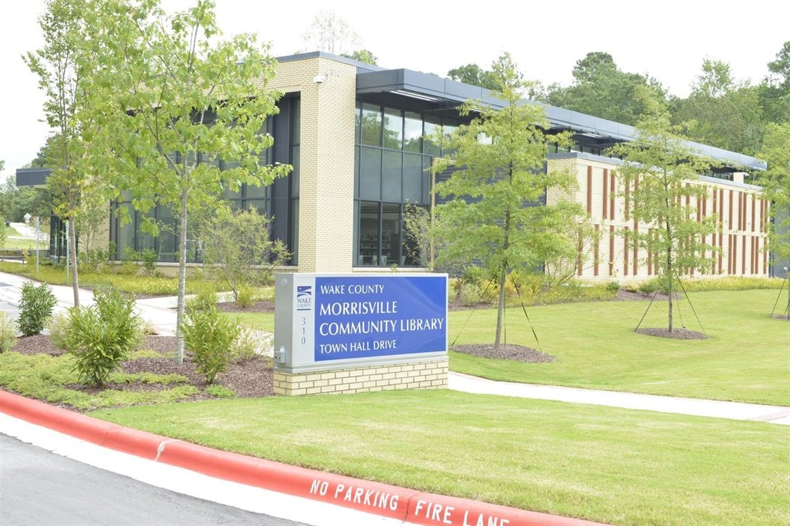 Morrisville Community Library building and entrance sign beside Town Hall Drive