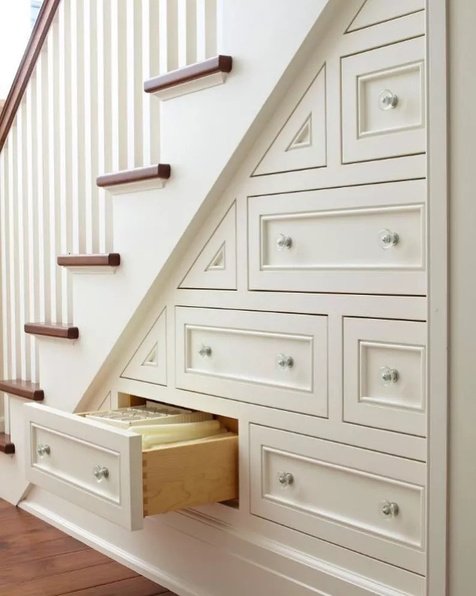 Built-in drawers fitted beneath a staircase