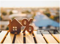 House and percentage symbols representing mortgage interest rates